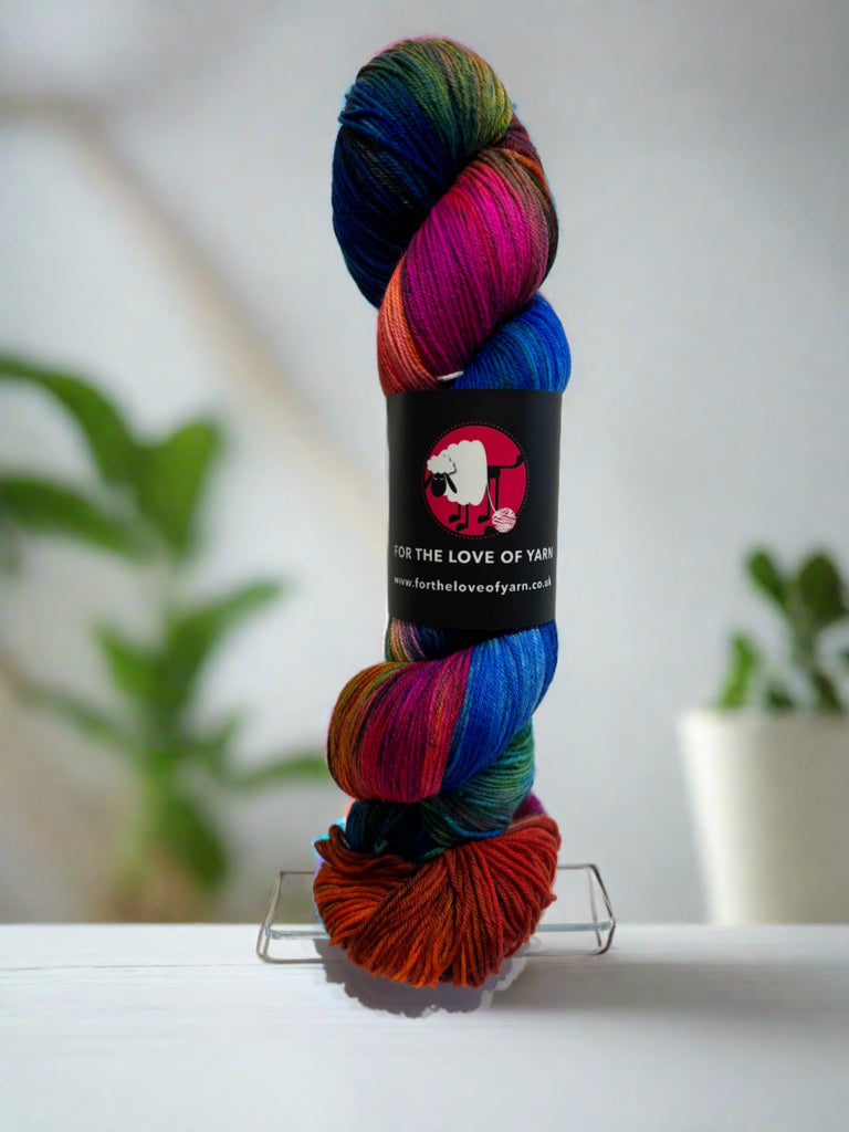 A skein of multi-coloured merino and nylon yarn, Utopia, in blues, inks, green and brown
