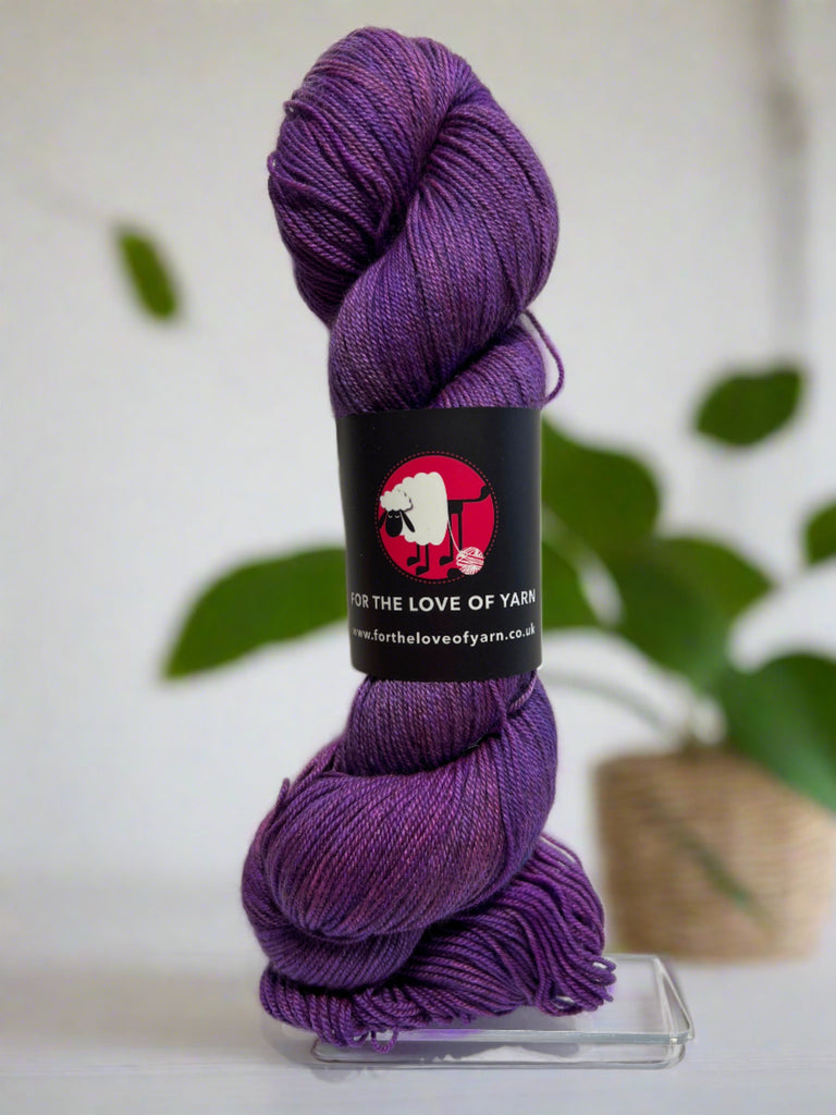 A skein of Ya Belter merino, silk and yak yarn in purple