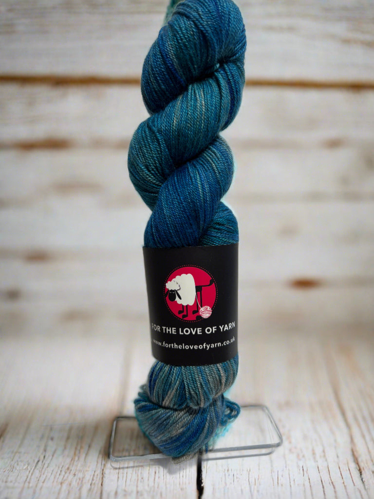 A skein of Pure Baltic merino, silk and yak yarn in blue
