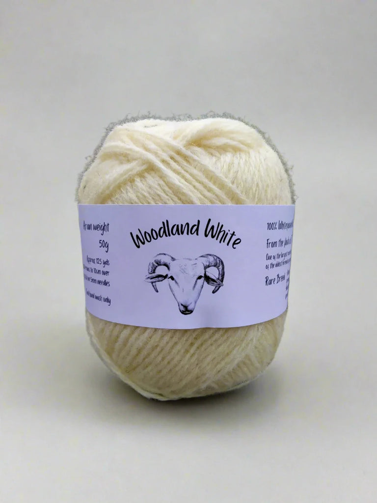 Image of rare breed yarn from Woodland white Sheep in a 50g ball.  The yarn is natural white